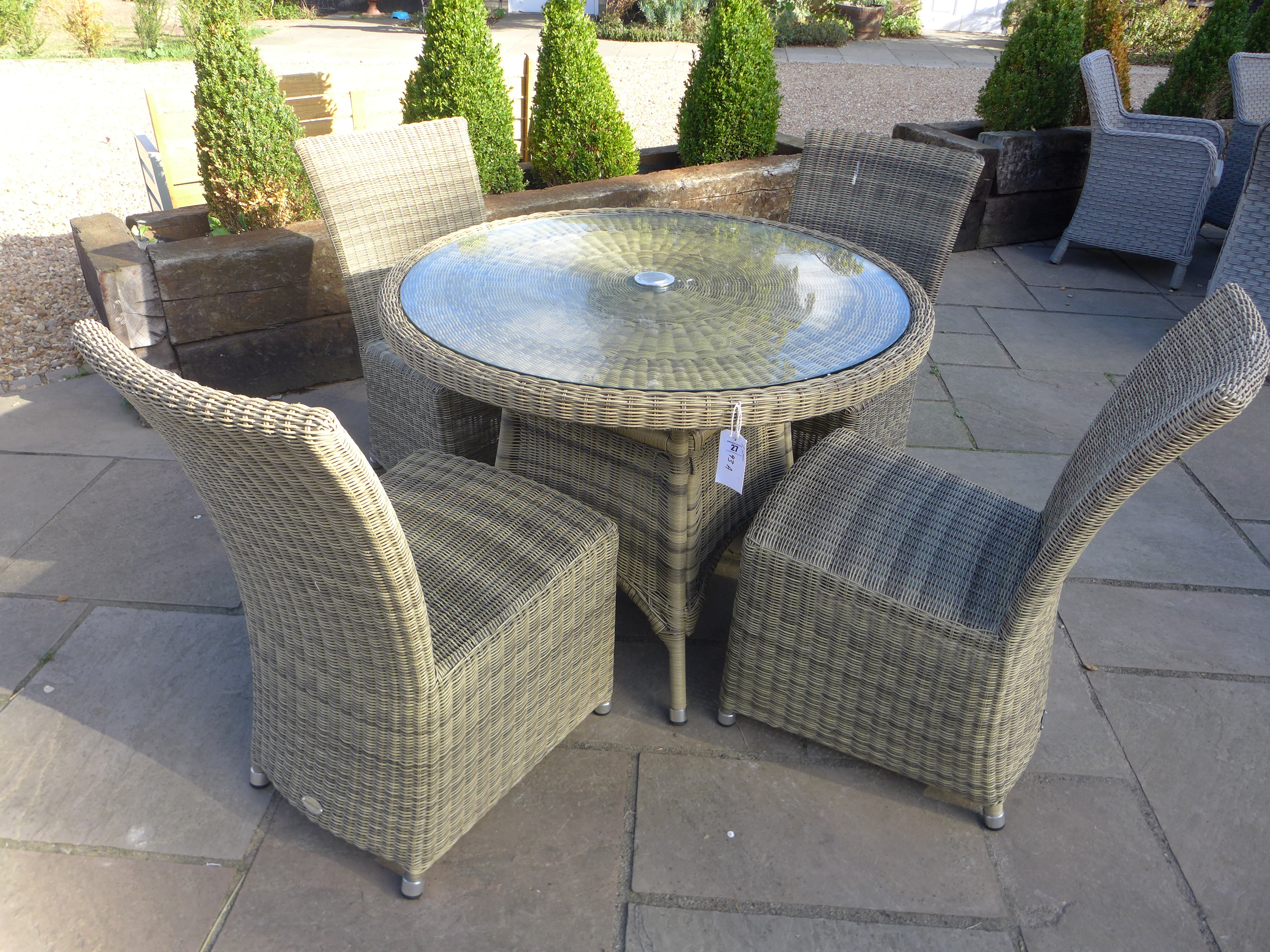 A Bramblecrest Sahara circular table with four chairs - Diameter 100cm