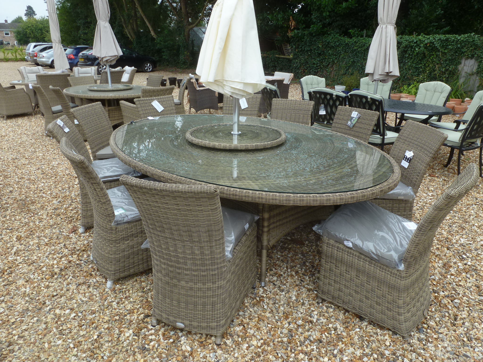 A Bramblecrest Sahara 250cm x 175cm table with lazy susan, ten side chairs,