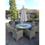 A Bramblecrest Cotswold table and six chairs with lazy susan,