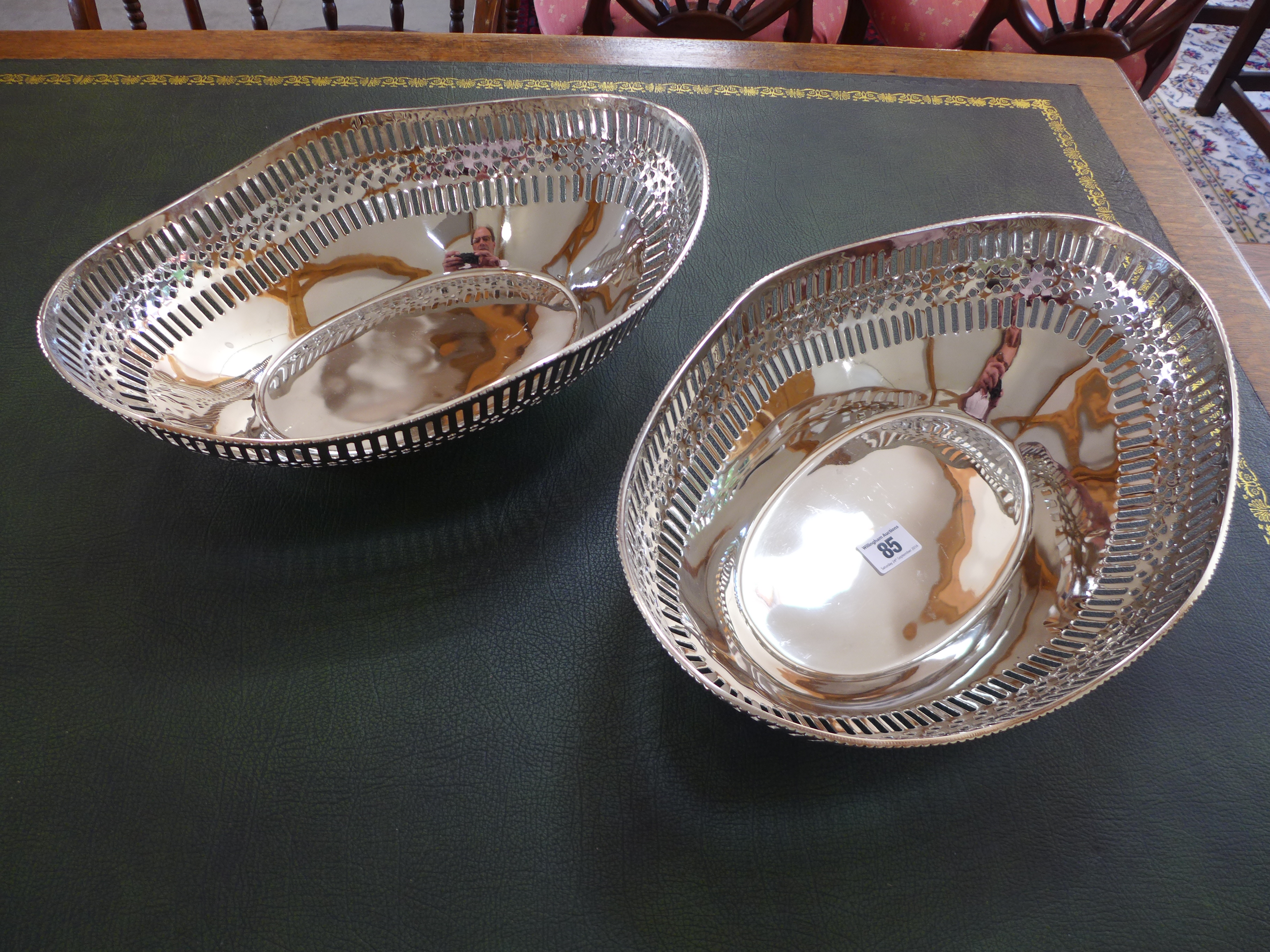 A pair of plated pierced dishes