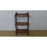 A Victorian mahogany three tier whatnot on barleytwist supports - Height 100cm x 58cm x 34cm