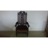 A 19th century carved oak open armchair on sugar barley supports - Height 122cm x Width 66cm x