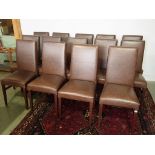 A set of fourteen brown leather dining chairs