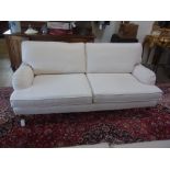 A two seater sofa in an off white fabric - Width 2m x Depth 96cm x Height 90cm - only 2 years old