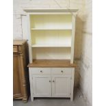 A modern painted dresser with open rack top above a two drawer,