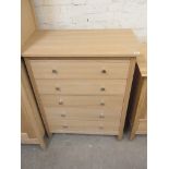 An oak five drawer chest - Height 104cm x 113cm x 63cm