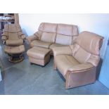 A designer Ekornes stressless reclining three piece suite in light brown leather with two