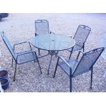 A used mesh garden set with four chairs and a round table - Diameter 105cm