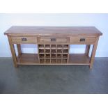 An oak sideboard with three drawers above a wine rack and potboard - Height 83cm x 180cm x 45cm