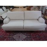 A two seater sofa in an oatmeal fabric - Width 2m x Depth 96cm x Height 90cm - only two years old