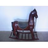 A modern hardwood rocking horse - Height 106cm