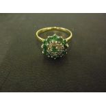 An 18ct yellow gold diamond and emerald cluster ring - Size P - Weight approx.