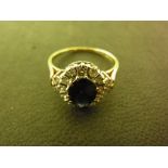 An 18ct yellow gold diamond and sapphire ring - Size O - sapphire approx. 7mm x 6mm - Weight approx.