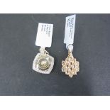 A 9ct gold topaz and diamond pendant and a 9ct gold Honey quartz and diamond pendant - approx