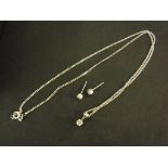A 9ct white gold necklace with diamond pendant and a pair of white gold diamond earrings - Total