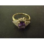 A yellow gold amethyst and diamond ring believed to be 9ct gold...Size P- Weight approx. 2.