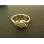 An 18ct yellow and white gold diamond three stone ring - Diamond 1 stone,