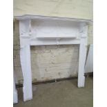 A white painted pine Adams style fire surround - Height 141cm x Width 138cm - internal 95cm x 95cm