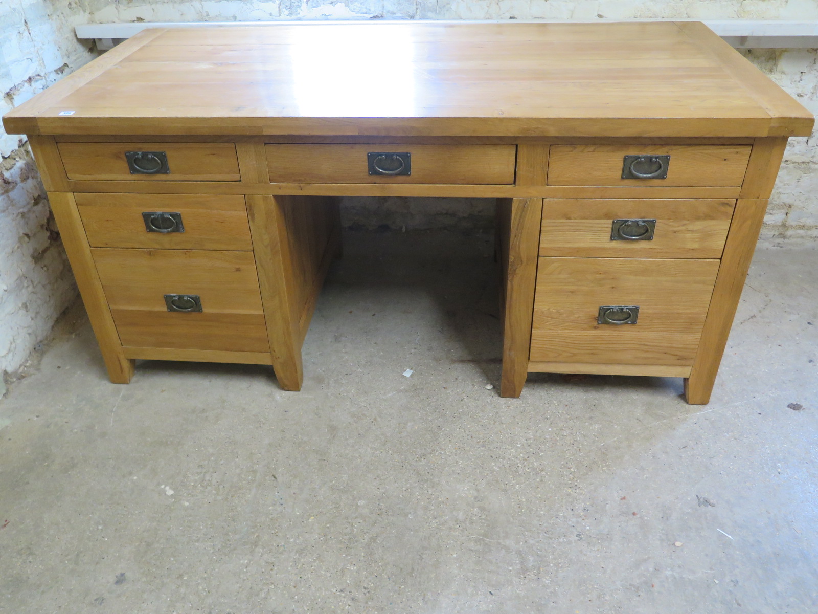 An oak twin pedestal desk with an arrangement of seven drawers - Height 84cm x 180cm x 86cm - Image 2 of 2