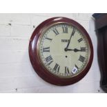 An 8 day wall clock with 12" dial