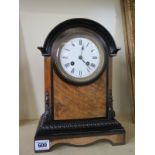 A walnut and ebony 8 day mantle clock - strikes hours and halfs