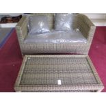 A Bramblecrest Sahara Classic two seater sofa with cushion and a coffee table - slight damage to