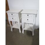 A pair of shabby chic two drawer bedside chests