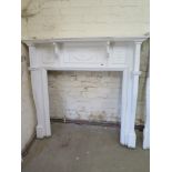 A white painted pine Adams style fire surround - Height 132cm x Width 142cm - internal 95cm x 95cm