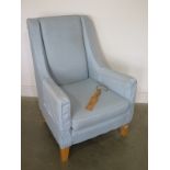 A Multiyork light blue upholstered armchair - Height 103cm x Width 73cm x Depth 78cm