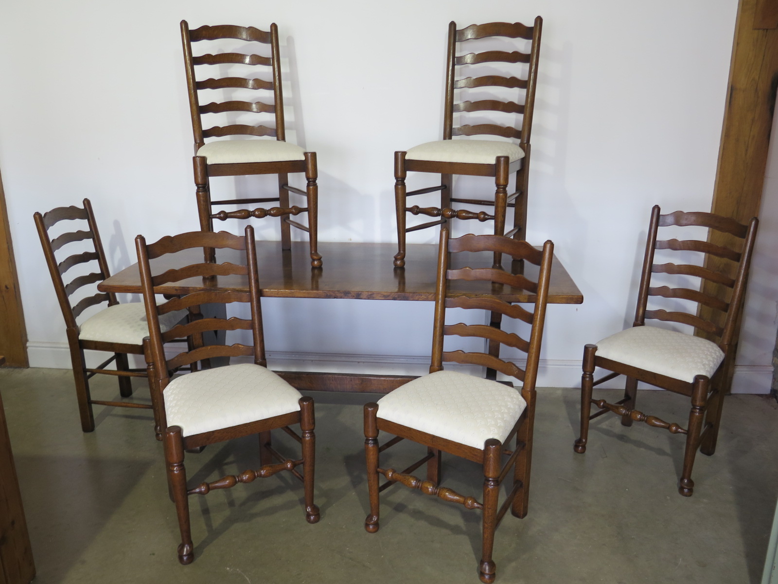 An oak refectory table from Titchmarsh and Goodwin - Height 76cm x 183cm x 80cm with six oak