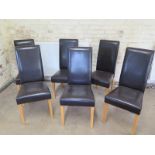 A set of six modern faux leather dining chairs