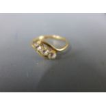 An 18ct yellow gold three stone ring - approx weight 3.