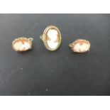 A 9ct yellow gold cameo ring size J/K and a pair of screw back 9ct gold cameo earrings