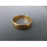 A 9ct gold band ring size W - approx 5 grams - some usage marks