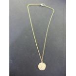 An 8ct yellow gold chain marked 333 with a Scorpio pendant presumed to be 9ct - Total weight approx.