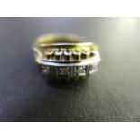 A 14ct ct yellow gold ring set with four small diamonds - Ring size P/Q - Weight approx.