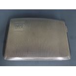 A silver cigarette case hallmarked Birmingham 1931/32 engine turned finish to exterior with silver