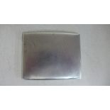 A silver hallmarked cigarette case bow fronted with engine turned finish,