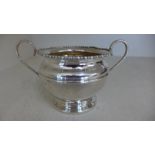 A silver hallmarked twin handled cup with shaped rim hallmark for Birmingham 1923/24 - approx