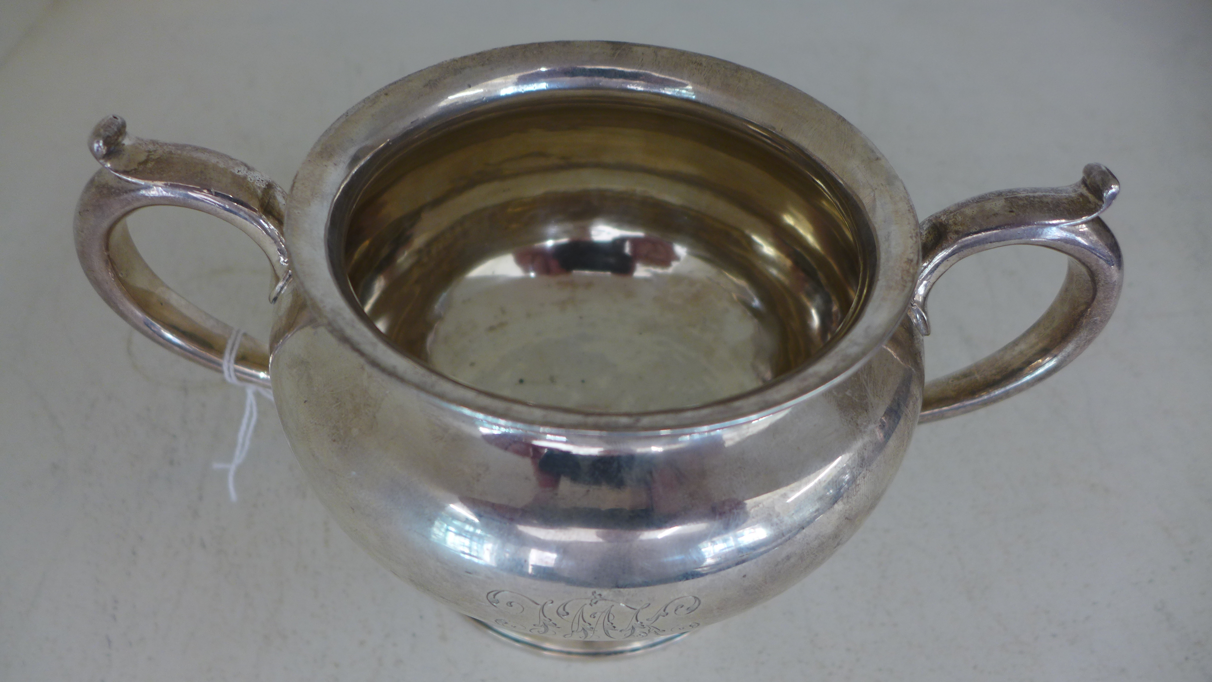 A silver hallmarked twin handled bowl of circular form raised on single pedestal base marked for - Image 2 of 2