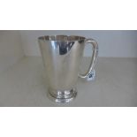 A silver hallmarked tankard - Height 14cm - with single handle,