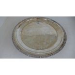 A silver hallmarked salver with scrolling band interspaced with circular raised knops engraved