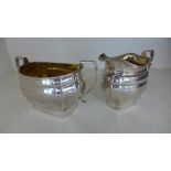 A silver hallmarked sugar and milk jug both with silver gilt interiors marked for Birmingham