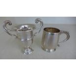 A silver hallmarked miniature tankard engraved to one side Christopher John May 26th 1939 - and one