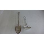 A silver hallmarked serving spoon mark for London 1871/72 and a silver ladle,