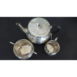 A silver hallmarked three piece tea service consisting of teapot,