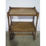 An oak barley twist tea trolley - Height 80cm x 65cm x 40cm