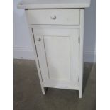 A painted pot cupboard