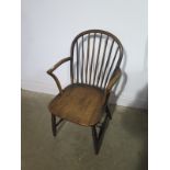 A 19th century stick back elbow chair - Height 84cm