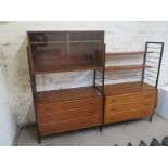 A Ladderax cabinet/chest with a two door glazed top and shelves over six drawers - 185cm x 150cm